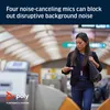 A woman is using a transit gate while wearing earbuds. Produktbild-Vorschau