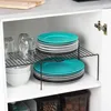 A cabinet shelf holding plates, glasses, and bowls. Anteprima dell’immagine prodotto