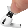 A finger is shown attaching a clear ear tip to a white earbud. Produktbild-Vorschau