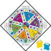A Trivial Pursuit board game is laid out diagonally on a white background, with two small plastic card holders and a die in the foreground. Anteprima dell’immagine prodotto