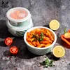 A still life arrangement of food storage containers and food items, including pasta, tomatoes, lemons, and bell peppers, on a textured surface. Produktbild-Vorschau