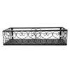 A black metal shelf with decorative scrollwork. Náhled obrázku produktu