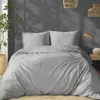 A bedroom scene with a bed, plant, and lighting. Anteprima dell’immagine prodotto