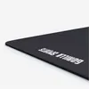 A close-up, angled view of a black yoga mat with white text on it, set against a white background. Náhľad obrázku produktu
