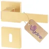A gold-colored door handle set with a keyhole escutcheon and a branded tag. Produktbild-Vorschau