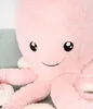A close-up shot of a pink plush octopus toy. Produktbild-Vorschau