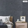 A bedroom scene with acoustic panels on the wall behind a bed and a nightstand. Podgląd zdjęcia produktu
