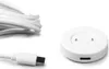 A white USB-A charging cable and a white inductive charging puck for a smartwatch are displayed on a white background. Podgląd zdjęcia produktu