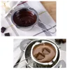 Two images showing a stainless steel double boiler insert with melted chocolate, one with chocolate cubes and the other with a larger amount of melted chocolate. Voir les images du produit