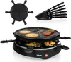 A Tristar 6-person raclette grill is shown from a slightly elevated angle, with some food items on the grill and in the lower trays. The grill is black and appears to be new. The image also shows a separate top plate with pancake molds and a stack of racle Anteprima dell’immagine prodotto