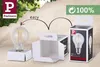 A lightbulb and its packaging are shown, demonstrating how the bulb fits into the box. Produktbild-Vorschau