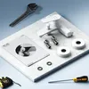 A white faucet and its installation components are laid out on a marble surface, with tools nearby. Produktbild-Vorschau