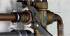 A close-up shot of a plumber using Knipex Cobra pliers to tighten a fitting on copper pipes connected to a water valve. Anteprima dell’immagine prodotto