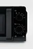 A close-up view of the control panel and handle of a black microwave oven. Podgląd zdjęcia produktu