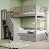 A gray bunk bed with stairs and storage is shown in a room with light green walls. Náhled obrázku produktu
