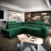 A luxurious green sectional sofa is displayed in a modern living room setting, with a spiral staircase and fireplace visible in the background. Produktbild-Vorschau