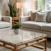 A living room scene with a coffee table, sofa, and chairs. Produktbild-Vorschau