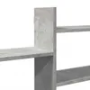 A close-up view of a concrete-gray shelf unit. Náhled obrázku produktu