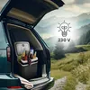 A portable cooler filled with drinks and fruit is placed in the open trunk of a car, with a scenic mountain landscape in the background. Anteprima dell’immagine prodotto