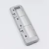 A close-up, angled view of a robot vacuum cleaner's main brush cover, presented against a plain white background. Produktbild-Vorschau
