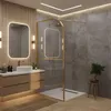 A modern bathroom with a shower enclosure, vanity, and mirror. Náhled obrázku produktu