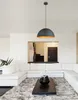 A modern living room with a sectional sofa, coffee table, and a pendant light. Produktbild-Vorschau