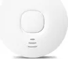 A close-up, top-down view of a white smoke detector with a central button and three horizontal lines indicating a speaker or sensor. Produktbild-Vorschau
