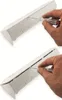A hand using a screwdriver to open a white power strip. Produktbild-Vorschau