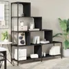A black, multi-tiered bookshelf filled with various decorative items and office supplies, placed in a room with a large potted plant and a small table. Náhled obrázku produktu