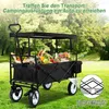 A black foldable wagon filled with groceries and flowers, set in a grassy outdoor area with trees in the background. Produktbild-Vorschau