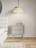 A bedside table with two drawers next to a bed in a bedroom. Produktbild-Vorschau