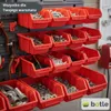 A wall-mounted storage system with multiple red bins filled with various hardware and tools, set in a workshop environment. Produktbild-Vorschau