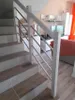 Interior view of a home with a staircase and living area. Produktbild-Vorschau