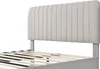 A close-up view of a bed frame with a light gray-beige upholstered headboard and wooden slats. Produktbild-Vorschau
