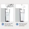 Two images showing how to add water and ice to a coffee machine's water tank for cold brewing. Produktbild-Vorschau