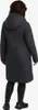 A person wearing a black winter jacket and black leggings, viewed from the back. Produktbild-Vorschau