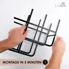Hands assembling a black metal wine rack against a white background. Produktbild-Vorschau
