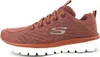 A side view of a pink Skechers sneaker against a white background. Voir les images du produit