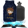 A Harry Potter themed hot water bottle with a plush cover is shown next to a plain black hot water bottle, with an open book emitting light and smoke at the bottom. Anteprima dell’immagine prodotto