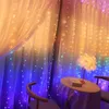 A room decorated with string lights and curtains, featuring a small table and chair. Produktbild-Vorschau
