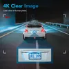 A car driving on a road at night, with a close-up of its license plate. Produktbild-Vorschau
