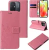 Collage of product images showing a pink floral butterfly flip phone case for a Xiaomi Redmi 12C. Produktbild-Vorschau