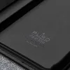 A close-up view of a black leather wallet with embossed text. Náhled obrázku produktu