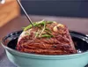 A piece of meat seasoned with herbs and garlic, with a thermometer inserted into it, in a roasting dish. Náhľad obrázku produktu