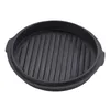 A black cast iron grill pan lid with raised ridges. Produktbild-Vorschau