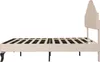 A side view of a beige upholstered bed frame with a tufted headboard and a slatted mattress support. Produktbild-Vorschau