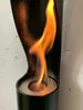 A close-up shot of a black ethanol fireplace with a flame burning. Produktbild-Vorschau