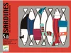 The image shows the front of a board game box with a colorful illustration of stylized sardines wearing clothes. Voir les images du produit