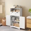 A white bathroom cabinet with two doors and two drawers, filled with towels and toiletries, is shown in a bathroom setting. Produktbild-Vorschau