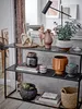 A collection of decorative items and plants displayed on a multi-tiered shelf. Produktbild-Vorschau